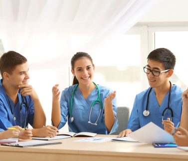 Group of medical students having lecture indoors